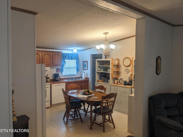 805 N Front St, Rockwood, TN 37854 - dining room with ornamental molding, a textured ceiling, light floors, wallpapered walls, and a chandelier