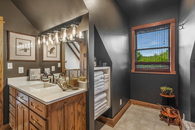 5959 River Trce, Nashville, TN 37218 - bathroom featuring tile patterned floors, baseboards, vanity, and lofted ceiling