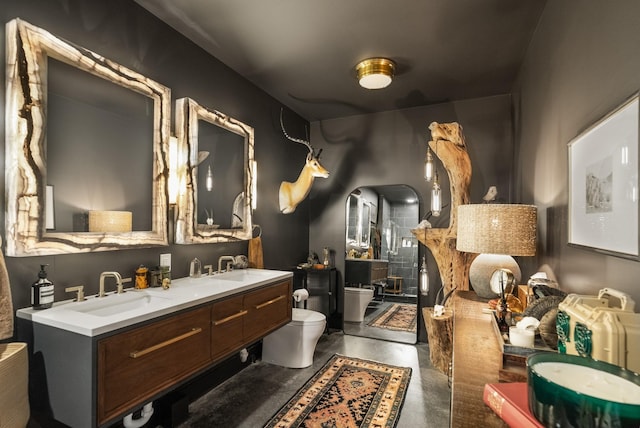 5959 River Trce, Nashville, TN 37218 - full bathroom featuring finished concrete floors, a sink, double vanity, and toilet
