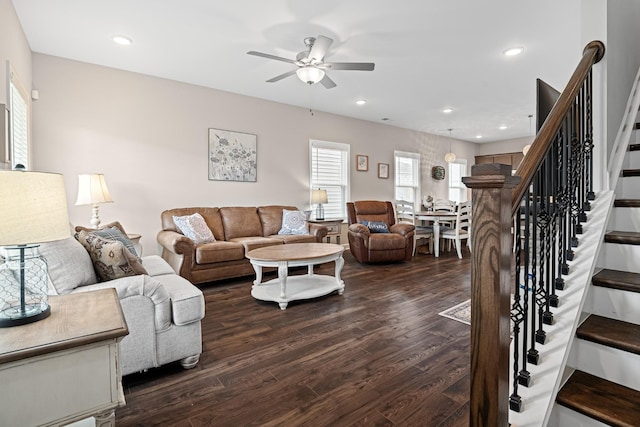 living area with recessed lighting, dark wood-style flooring, ceiling fan, and stairway