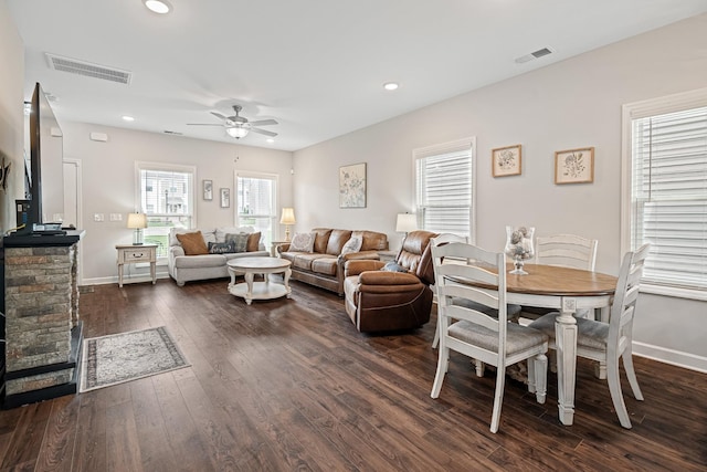 living room featuring visible vents, a ceiling fan, dark wood-type flooring, and recessed lighting
