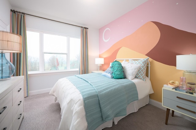 carpeted bedroom featuring baseboards