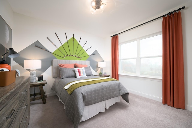 bedroom with baseboards and carpet flooring