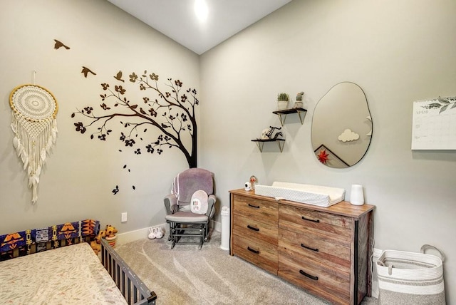 bedroom with carpet floors and baseboards