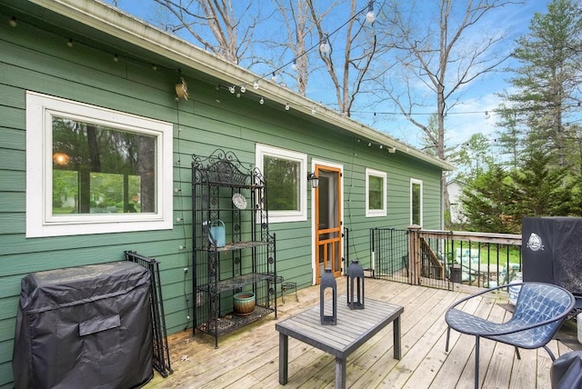 wooden deck featuring area for grilling