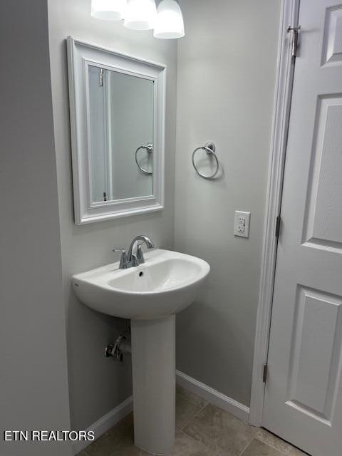 bathroom featuring tile patterned floors and baseboards