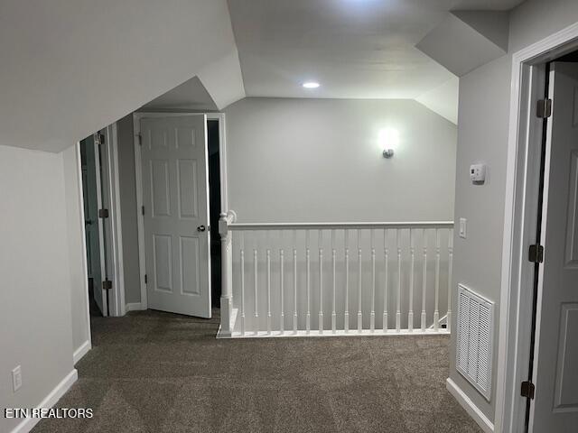 bonus room with vaulted ceiling, carpet, and visible vents