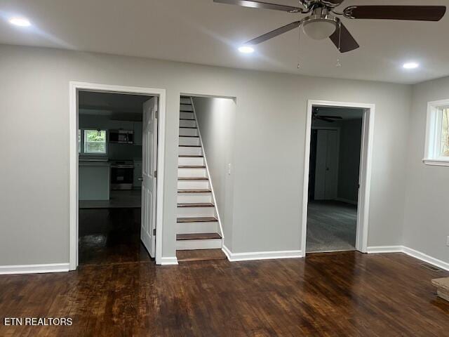 interior space with recessed lighting, baseboards, ceiling fan, wood finished floors, and stairway