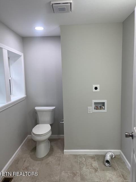 bathroom with tile patterned flooring, toilet, baseboards, and visible vents