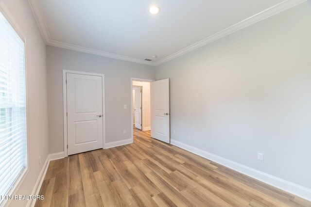 8888 Shaw Ferry Rd, Lenoir City, TN 37772 - unfurnished bedroom featuring light wood finished floors, baseboards, crown molding, and recessed lighting