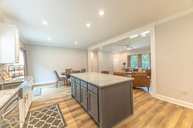 8888 Shaw Ferry Rd, Lenoir City, TN 37772 - kitchen with a sink, dishwasher, ornamental molding, light wood-style floors, and white cabinetry