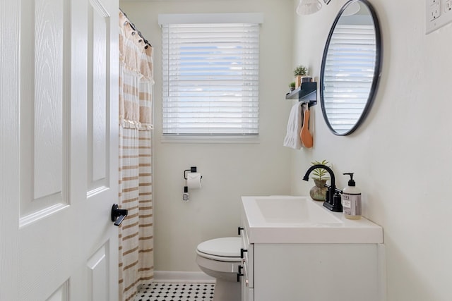 305 Aurora Ave, Madison, TN 37115 - bathroom featuring vanity, baseboards, a shower with shower curtain, and toilet
