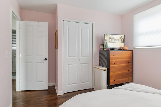 305 Aurora Ave, Madison, TN 37115 - bedroom with baseboards, dark wood-type flooring, and a closet