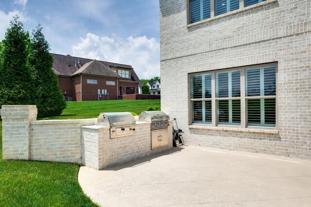 view of patio / terrace featuring exterior kitchen and grilling area