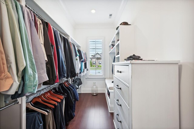spacious closet with dark wood-type flooring and visible vents