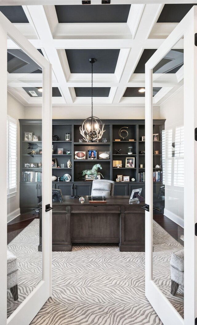 home office featuring baseboards, a wealth of natural light, and coffered ceiling