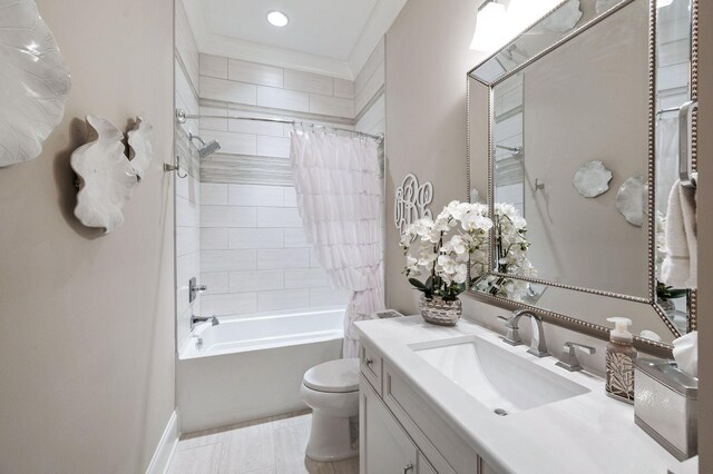 bathroom featuring recessed lighting, vanity, toilet, and shower / tub combo with curtain