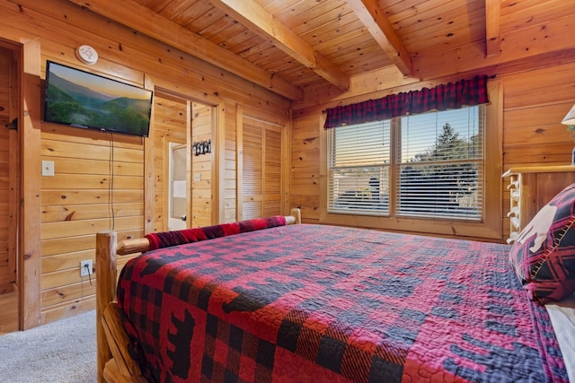 carpeted bedroom featuring wood ceiling, wood walls, and beam ceiling