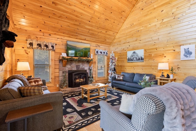 living area featuring wood ceiling, wood finished floors, wooden walls, and a fireplace