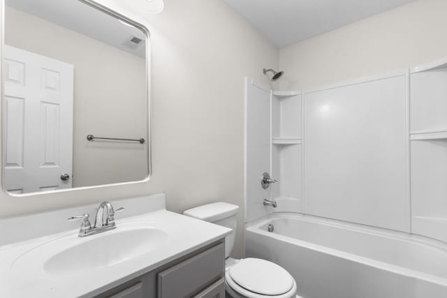 bathroom featuring shower / washtub combination, vanity, toilet, and visible vents
