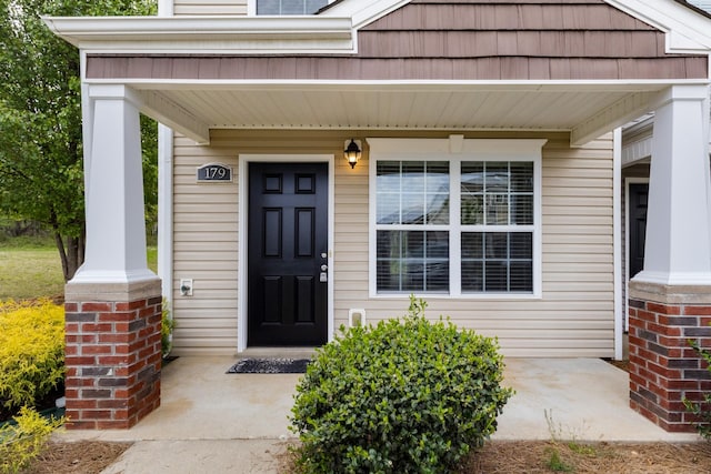 doorway to property featuring a porch