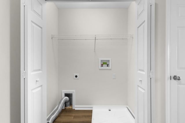 laundry area featuring hookup for an electric dryer, laundry area, dark wood-style flooring, baseboards, and hookup for a washing machine