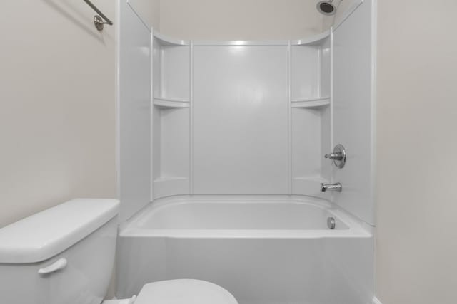 bathroom with shower / tub combination and toilet
