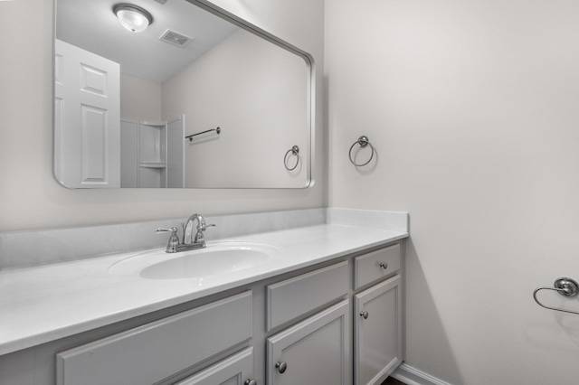 bathroom with visible vents and vanity