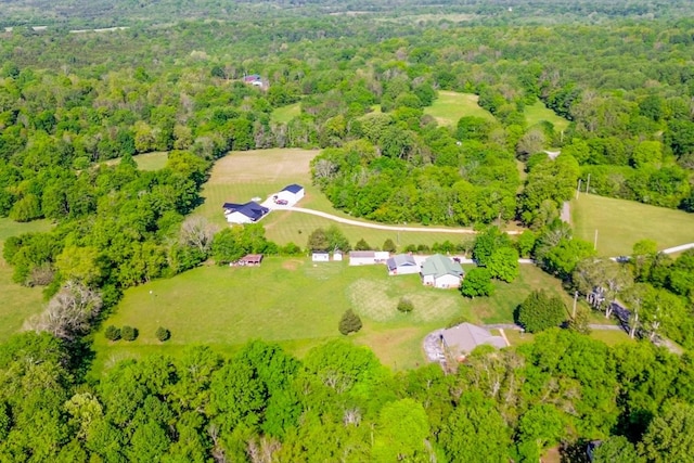 drone / aerial view featuring a forest view