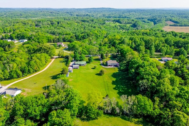 bird's eye view featuring a forest view