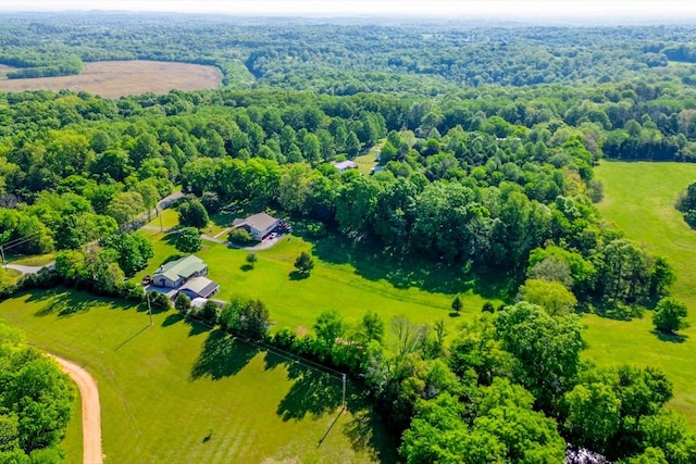 bird's eye view with a view of trees and a rural view
