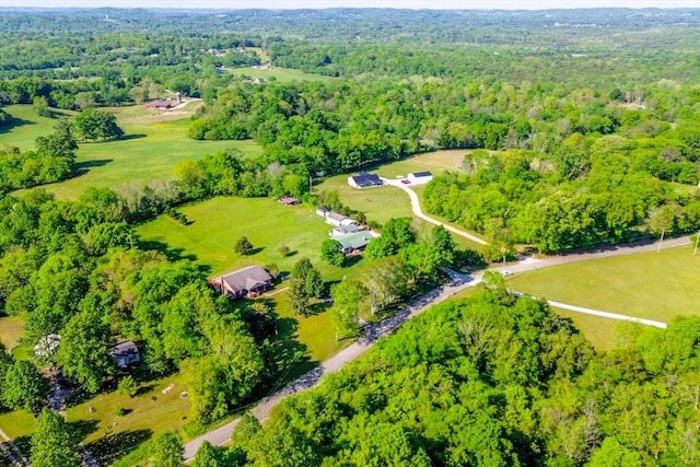 drone / aerial view featuring a view of trees
