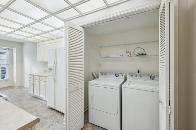 8508 Sawyer Brown Rd, Nashville, TN 37221 - clothes washing area with laundry area, baseboards, and independent washer and dryer