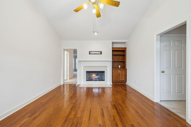 8508 Sawyer Brown Rd, Nashville, TN 37221 - unfurnished living room with baseboards, a ceiling fan, a fireplace with flush hearth, and wood finished floors