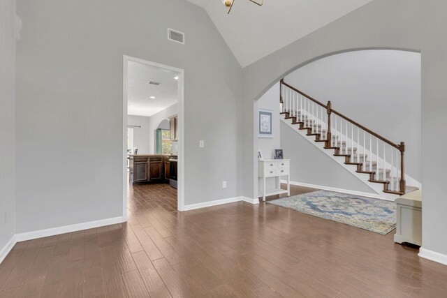 2095 Longhunter Chase Dr, Spring Hill, TN 37174 - foyer with arched walkways, visible vents, wood finished floors, and stairway