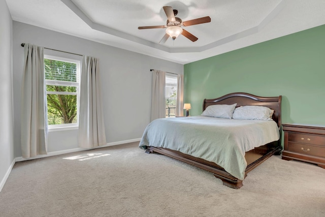 2095 Longhunter Chase Dr, Spring Hill, TN 37174 - bedroom featuring a ceiling fan, baseboards, carpet, and a tray ceiling
