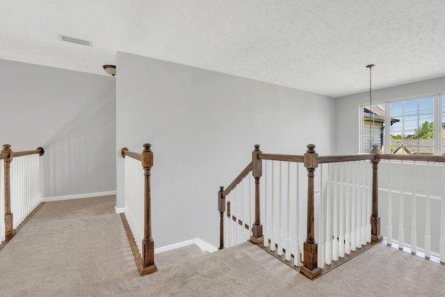 2095 Longhunter Chase Dr, Spring Hill, TN 37174 - stairs with visible vents, a textured ceiling, baseboards, and carpet floors
