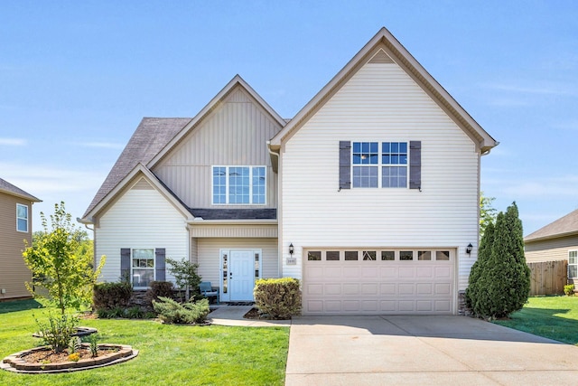 2095 Longhunter Chase Dr, Spring Hill, TN 37174 - traditional home featuring fence, a garage, board and batten siding, a front yard, and driveway