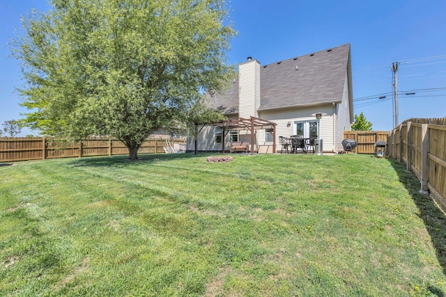 2095 Longhunter Chase Dr, Spring Hill, TN 37174 - rear view of house featuring a lawn, a pergola, a chimney, and a fenced backyard