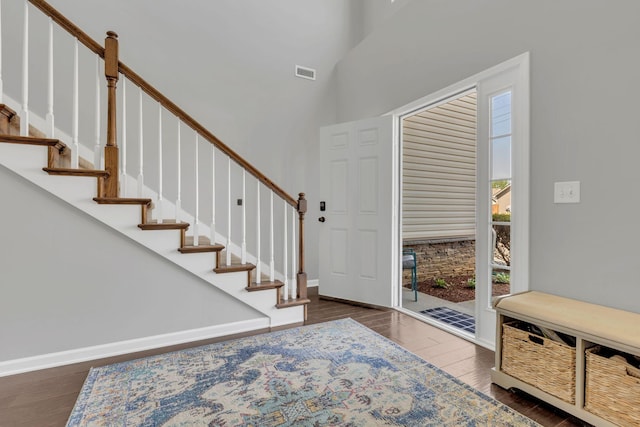 2095 Longhunter Chase Dr, Spring Hill, TN 37174 - entryway with a high ceiling, stairs, wood finished floors, and visible vents
