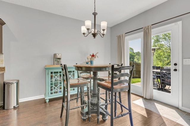 2095 Longhunter Chase Dr, Spring Hill, TN 37174 - dining space with baseboards, an inviting chandelier, and wood finished floors