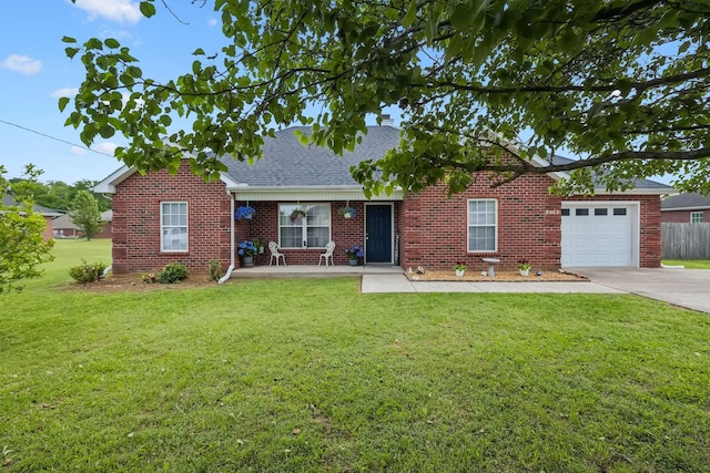 ranch-style house featuring a front yard, brick siding, a shingled roof, concrete driveway, and an attached garage