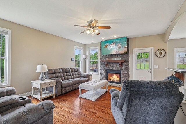 1792 Antler Rd, Woodlawn, TN 37191 - living room featuring a ceiling fan, plenty of natural light, wood finished floors, and a large fireplace