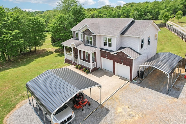 1792 Antler Rd, Woodlawn, TN 37191 - exterior space featuring an attached garage, a porch, a yard, and concrete driveway