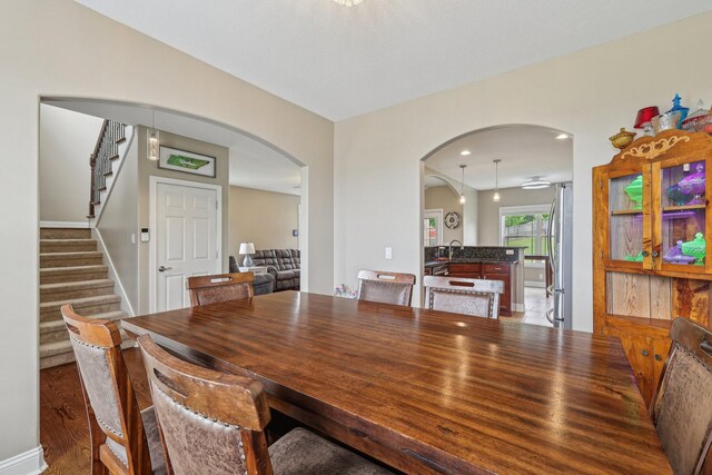 1792 Antler Rd, Woodlawn, TN 37191 - dining room with recessed lighting, arched walkways, stairs, and wood finished floors