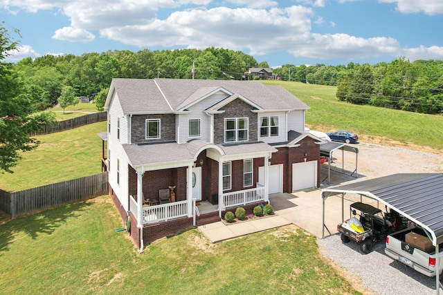 1792 Antler Rd, Woodlawn, TN 37191 - view of front facade featuring a front lawn, fence, covered porch, and concrete driveway