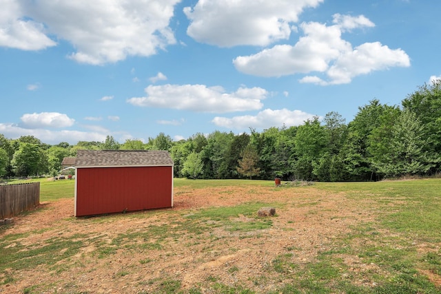 1792 Antler Rd, Woodlawn, TN 37191 - view of yard featuring a wooded view, fence, an outbuilding, and a storage unit