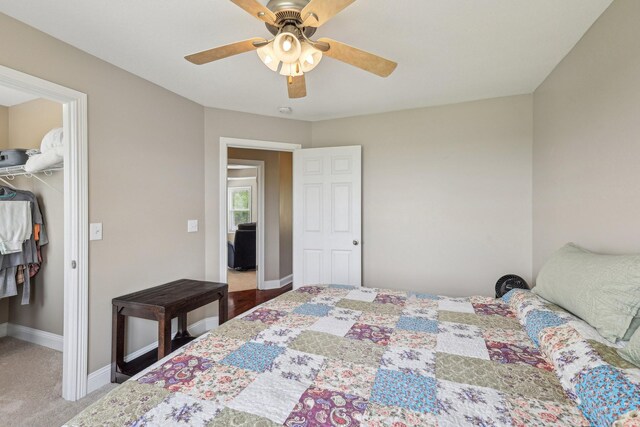 1792 Antler Rd, Woodlawn, TN 37191 - carpeted bedroom featuring a closet, a ceiling fan, baseboards, and a walk in closet