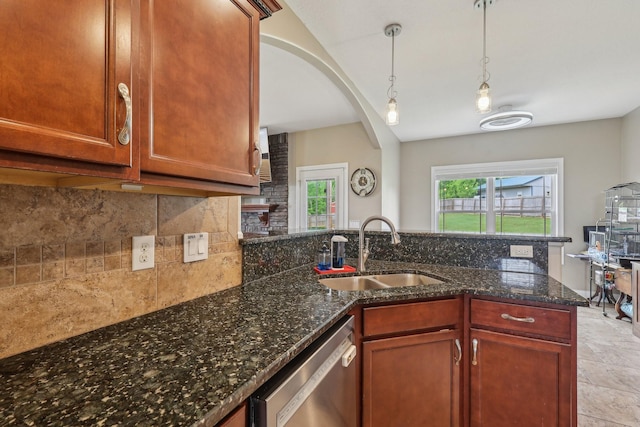1792 Antler Rd, Woodlawn, TN 37191 - kitchen with stainless steel dishwasher, decorative backsplash, arched walkways, a sink, and decorative light fixtures