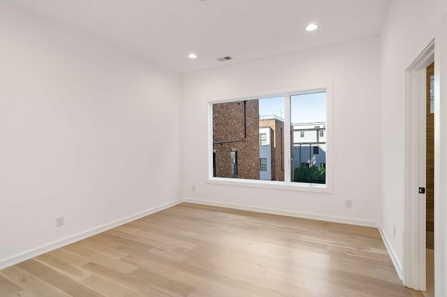 1017 12th Ave S Unit A, Nashville, TN 37203 - empty room with baseboards, recessed lighting, light wood finished floors, and visible vents